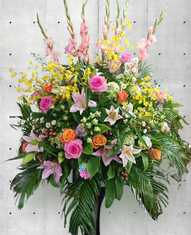 ピンクと黄色で明るく華やかな1段式祝スタエンド花